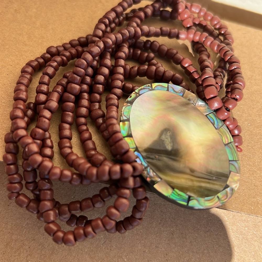 Beads and mother-of-pearl inlay.